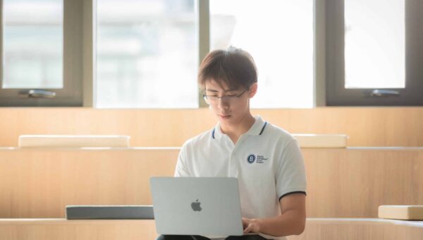 A BASIS International School Bangkok student coding on a laptop