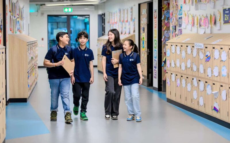 A teacher instructs a class of 5th grade-age students. A teacher instructing a class at BASIS International School Bangkok