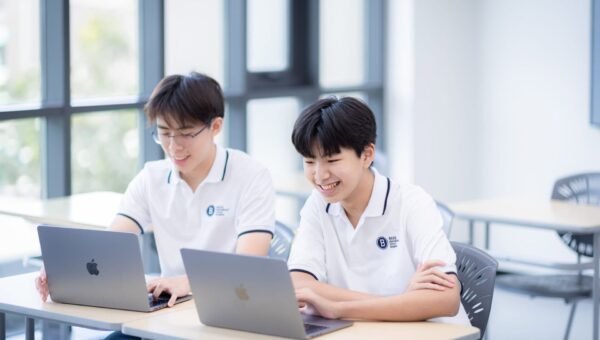 BASIS International School Bangkok students working together on laptops